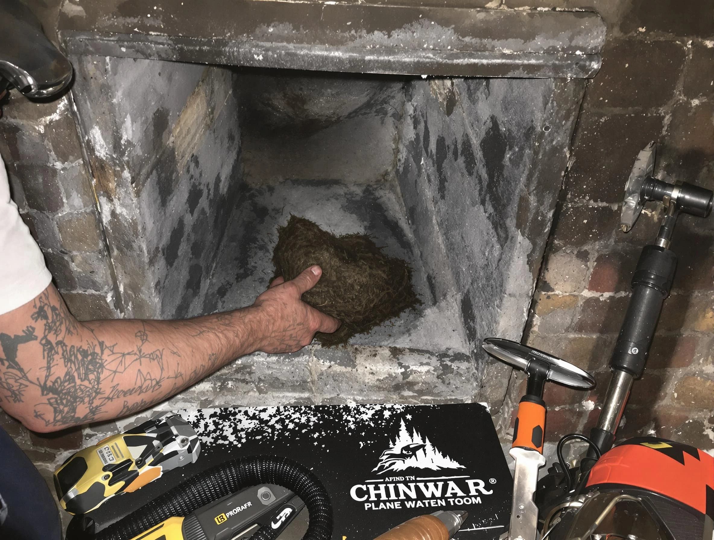 Jersey City Chimney Sweep safely removing debris and screening chimney in Jersey City, NJ